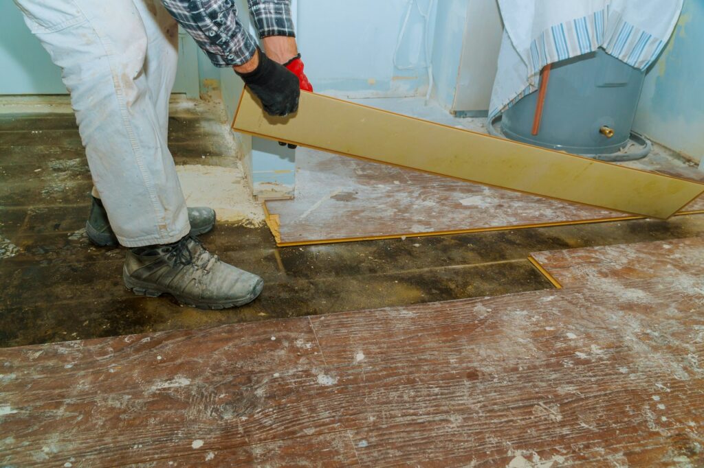 Demolish of old wooden parquet floor with house improvement renovation